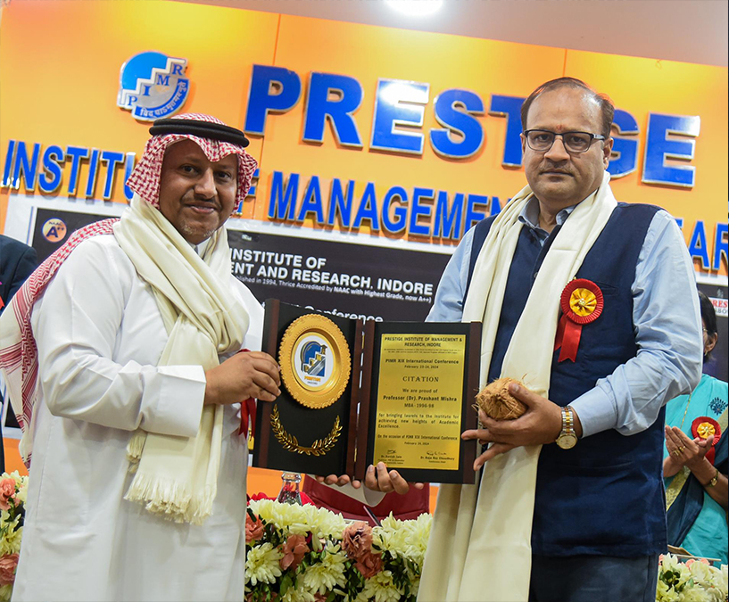 Dr. Prashant Mishra receiving award from HE Sheikh Mansoor Bin Khalifa during International Conference