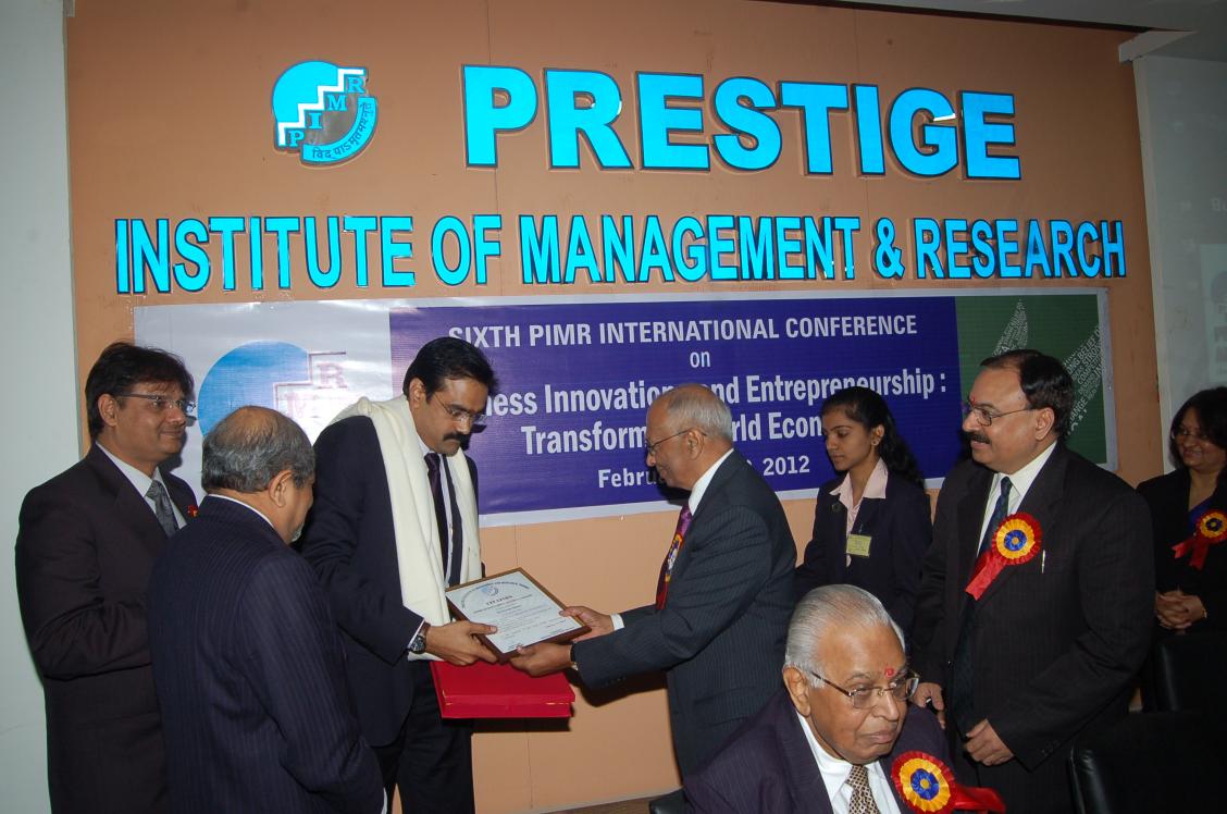 Mr. Suresh Shukla, VP, Kotak Securities  Ltd. receiving PIMR Outstanding Alumnus Award' 2012