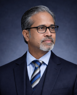 Professional headshot of a man